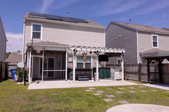 rear view of house with a patio area, solar panels, a pergola, a hot tub, and ceiling fan