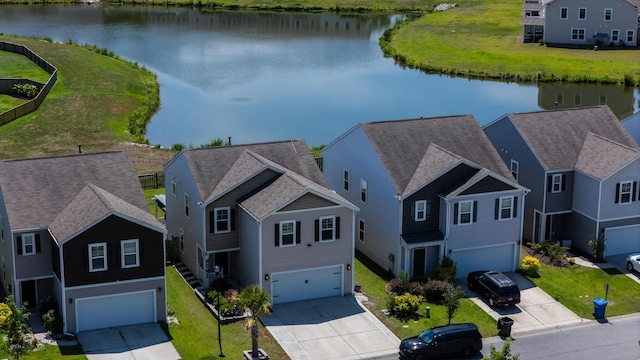 aerial view of residential area with a nearby body of water
