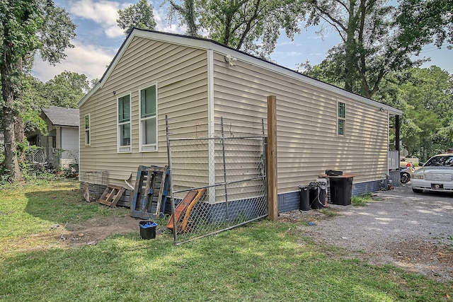 view of side of property featuring a yard