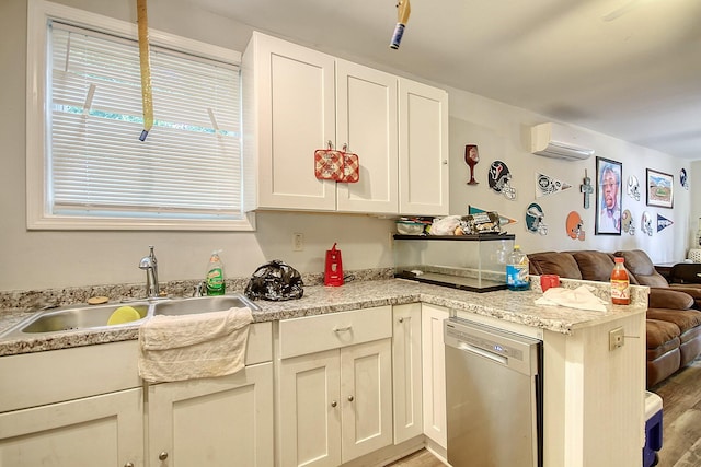 kitchen with a wall mounted air conditioner, dishwasher, white cabinets, sink, and kitchen peninsula