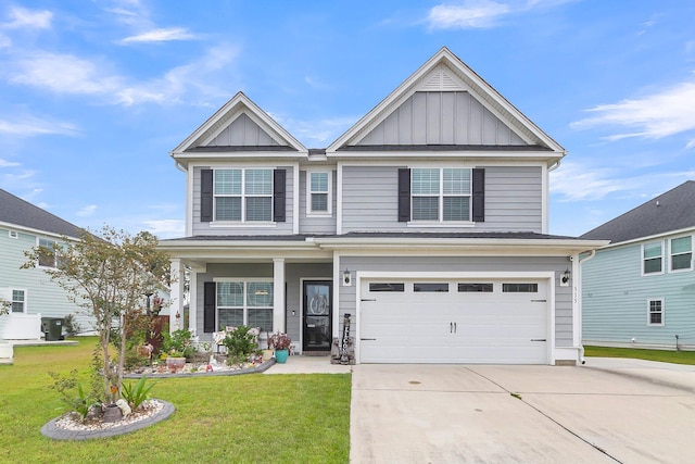 craftsman inspired home featuring a garage and a front yard