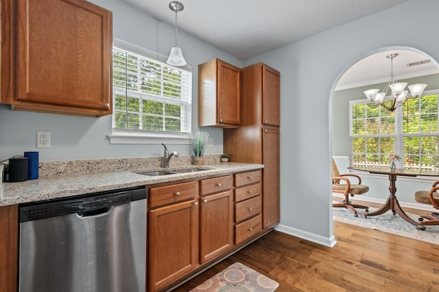 340 Stefan Dr, Charleston, SC 29412 - kitchen with stainless steel dishwasher, dark wood-style floors, brown cabinets, decorative light fixtures, and a chandelier