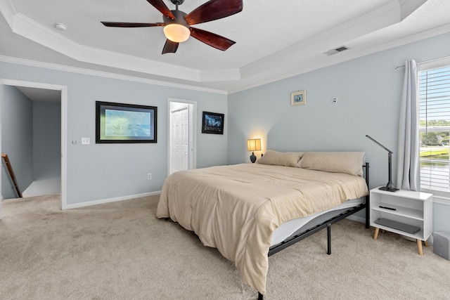 340 Stefan Dr, Charleston, SC 29412 - bedroom featuring a tray ceiling, ornamental molding, light colored carpet, ceiling fan, and connected bathroom