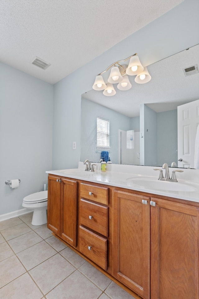 340 Stefan Dr, Charleston, SC 29412 - bathroom with double vanity, tile patterned flooring, and a textured ceiling