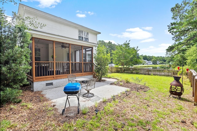 340 Stefan Dr, Charleston, SC 29412 - fenced backyard with a sunroom, a patio, a fire pit, and a ceiling fan