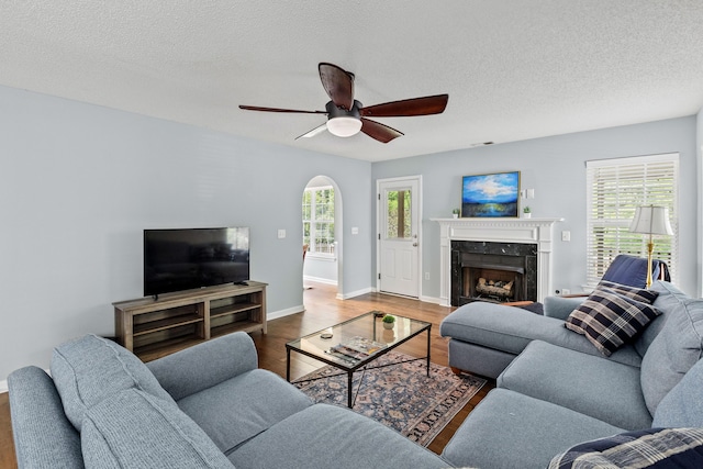 340 Stefan Dr, Charleston, SC 29412 - living area with wood finished floors, ceiling fan, a premium fireplace, and a textured ceiling