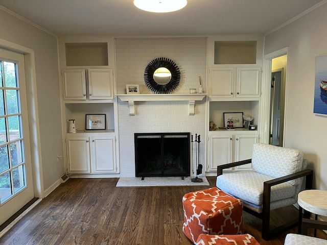 living room featuring crown molding, a fireplace, and dark wood-type flooring