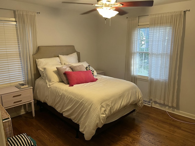 bedroom featuring ceiling fan and dark hardwood / wood-style floors