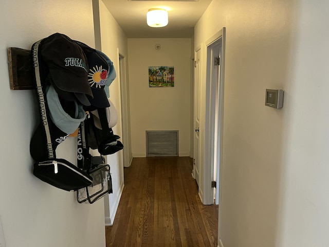 corridor featuring dark hardwood / wood-style floors