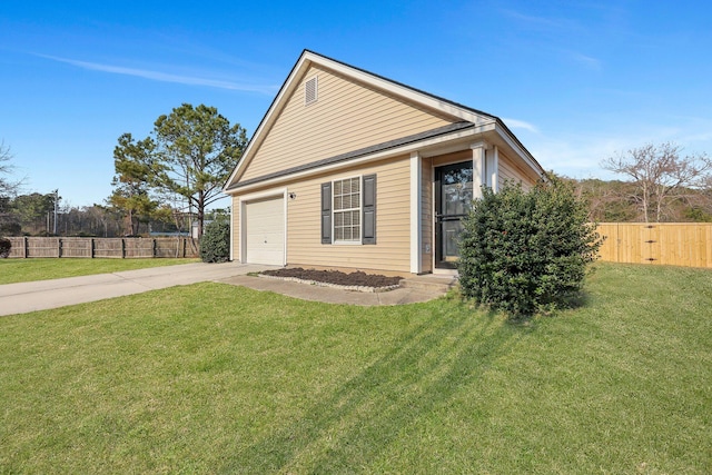 exterior space featuring concrete driveway, an attached garage, fence, and a lawn