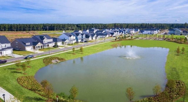 birds eye view of property featuring a residential view and a water view