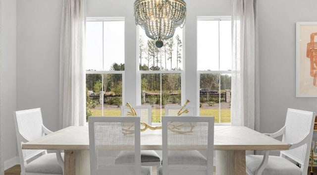 dining room featuring a chandelier and plenty of natural light