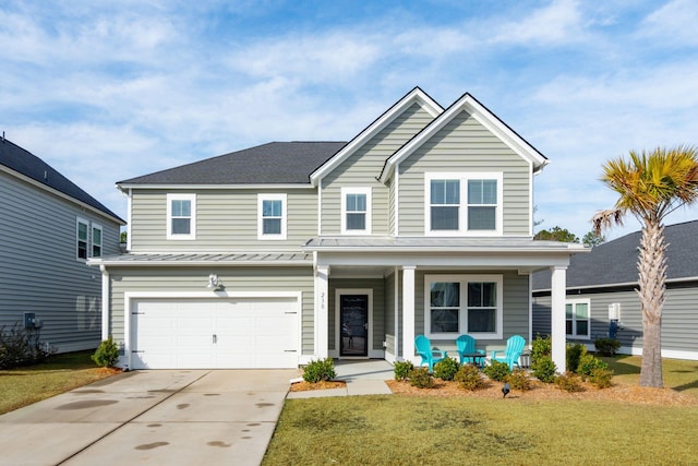 view of front facade with a garage, a front yard, and covered porch