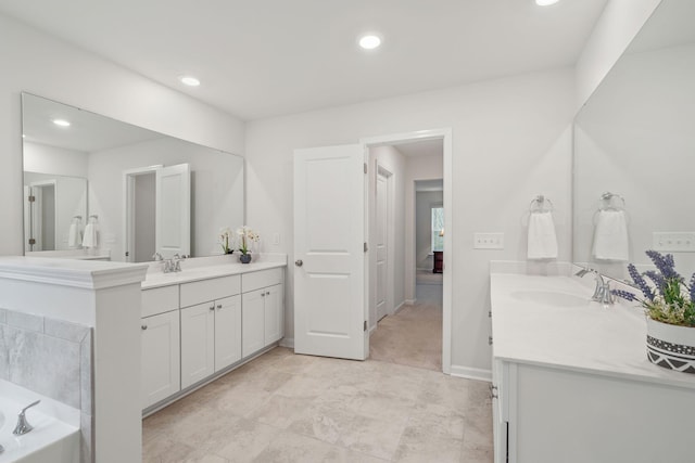 bathroom featuring vanity and a bathing tub