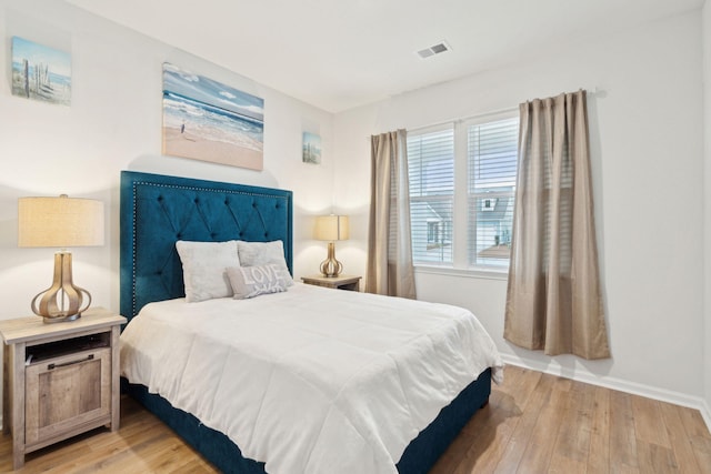 bedroom with light wood-type flooring