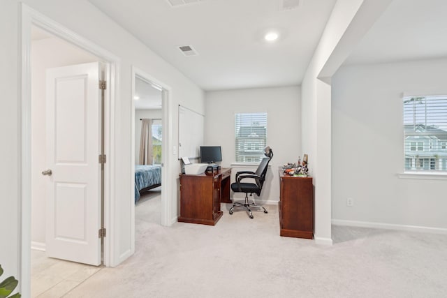 home office with light carpet