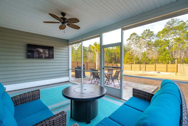 sunroom / solarium with ceiling fan