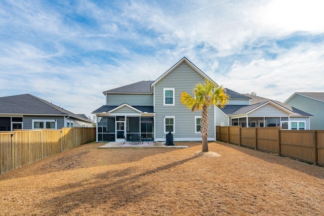 back of house with a patio and a sunroom