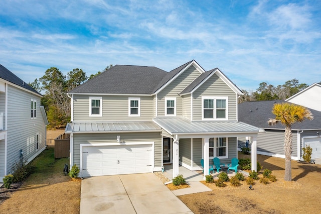 view of front of house with a garage and covered porch