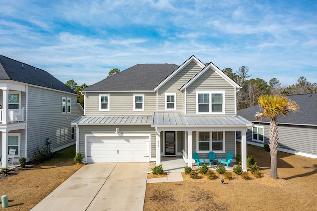 view of front of home with a garage and a porch