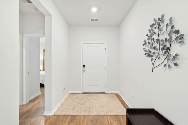 hall featuring wood-type flooring