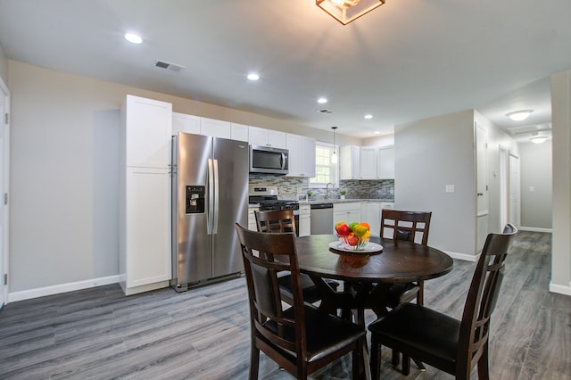 dining area with light hardwood / wood-style floors