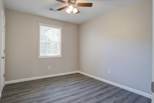 unfurnished room featuring ceiling fan and dark hardwood / wood-style floors