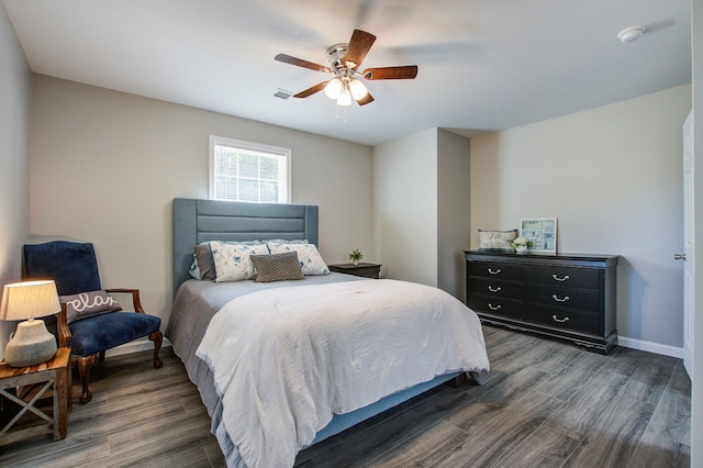 bedroom featuring ceiling fan and dark hardwood / wood-style floors