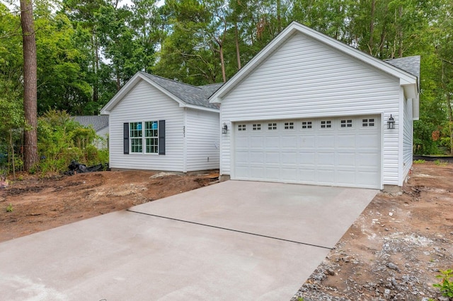 ranch-style house featuring a garage