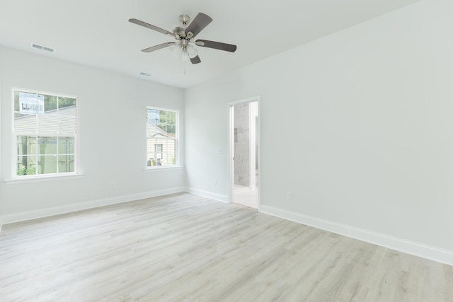 empty room featuring light hardwood / wood-style flooring and ceiling fan