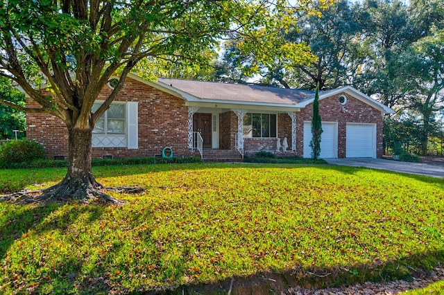 ranch-style home featuring a front yard, a porch, and a garage