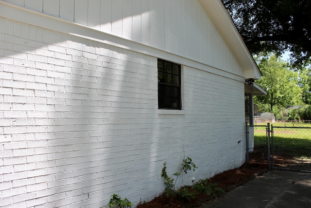 view of home's exterior featuring fence