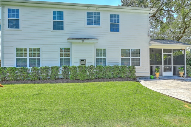 2150 Terrabrook Ln, Charleston, SC 29412 - rear view of house featuring a sunroom, a patio area, and a yard