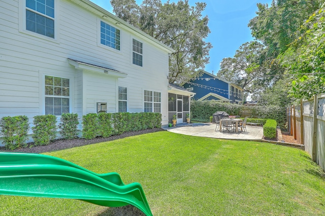 2150 Terrabrook Ln, Charleston, SC 29412 - back of property with a sunroom, a playground, a patio, and a fenced backyard
