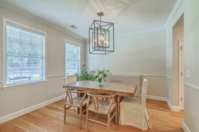 2150 Terrabrook Ln, Charleston, SC 29412 - dining room featuring light wood finished floors, a chandelier, and ornamental molding
