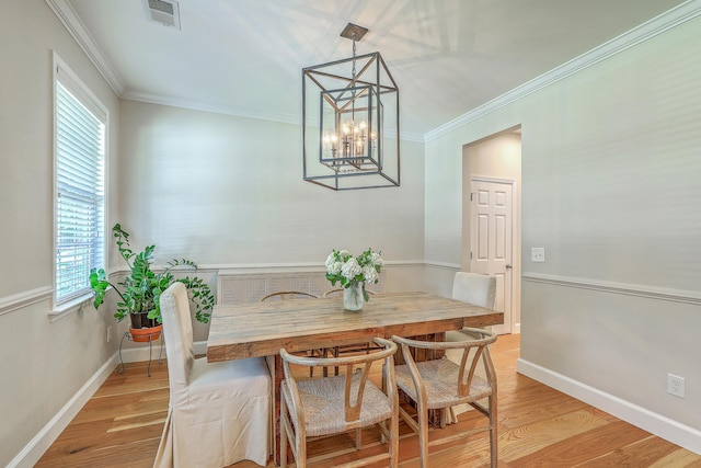 2150 Terrabrook Ln, Charleston, SC 29412 - dining room with a chandelier, plenty of natural light, light wood-type flooring, and ornamental molding
