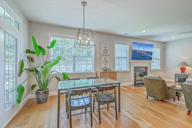 2150 Terrabrook Ln, Charleston, SC 29412 - dining space with light wood-style floors, a fireplace with flush hearth, and recessed lighting
