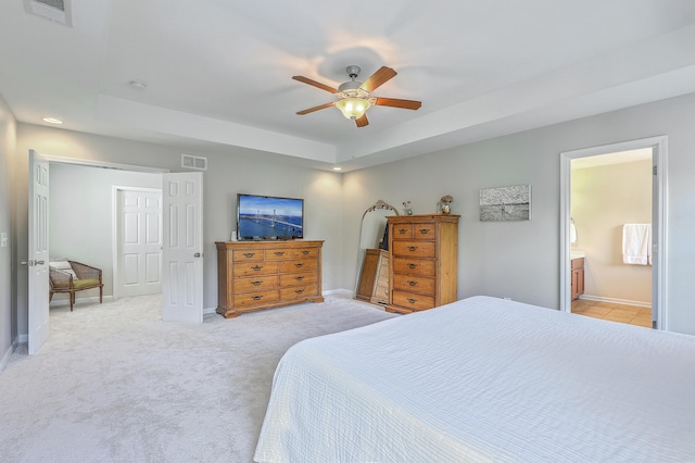 2150 Terrabrook Ln, Charleston, SC 29412 - bedroom with light colored carpet, a raised ceiling, recessed lighting, ceiling fan, and connected bathroom