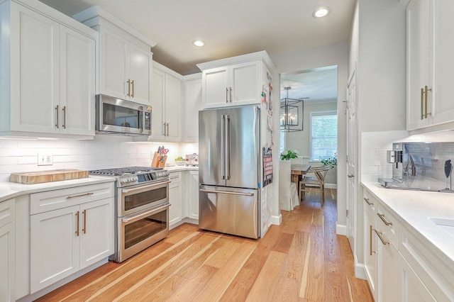 2150 Terrabrook Ln, Charleston, SC 29412 - kitchen featuring stainless steel appliances, light wood-style floors, light countertops, white cabinets, and recessed lighting