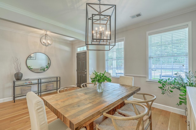 2150 Terrabrook Ln, Charleston, SC 29412 - dining space with a chandelier, light wood-style flooring, and ornamental molding