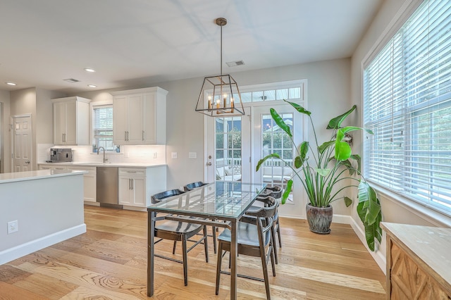 2150 Terrabrook Ln, Charleston, SC 29412 - dining room featuring a chandelier, healthy amount of natural light, light wood-style flooring, and recessed lighting