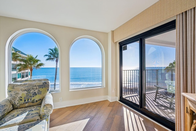 sunroom / solarium with a water view