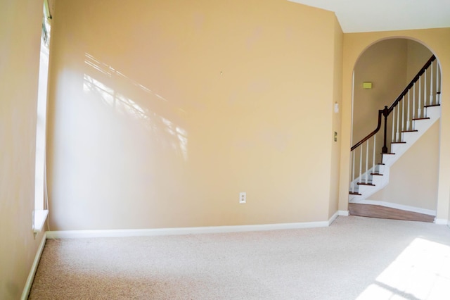 unfurnished room featuring carpet