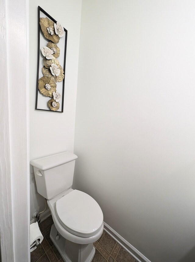 bathroom featuring tile patterned floors and toilet