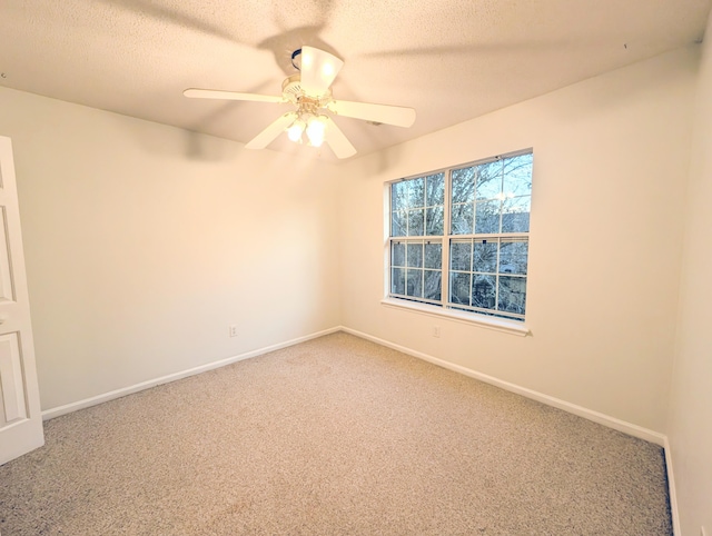 empty room with carpet, a textured ceiling, and ceiling fan