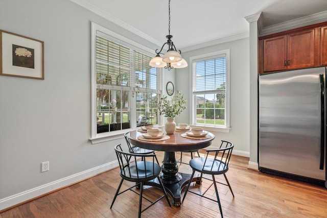 129 Saluda Dr, Moncks Corner, SC 29461 - dining space featuring ornamental molding, light wood-style floors, and a chandelier
