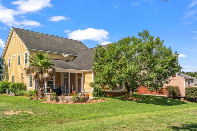 129 Saluda Dr, Moncks Corner, SC 29461 - rear view of property with a yard, a sunroom, and roof with shingles