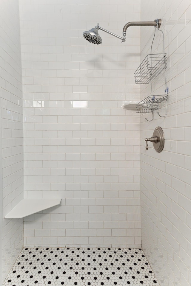 bathroom with a tile shower