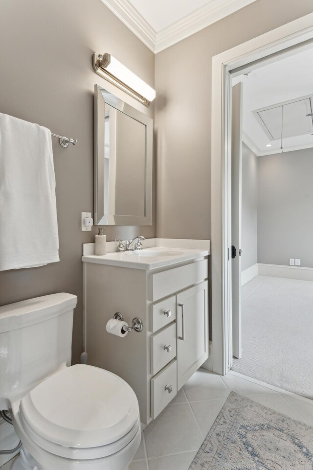 bathroom featuring ornamental molding, toilet, tile patterned flooring, and vanity