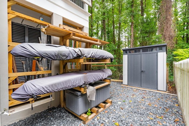 wooden deck featuring a storage shed